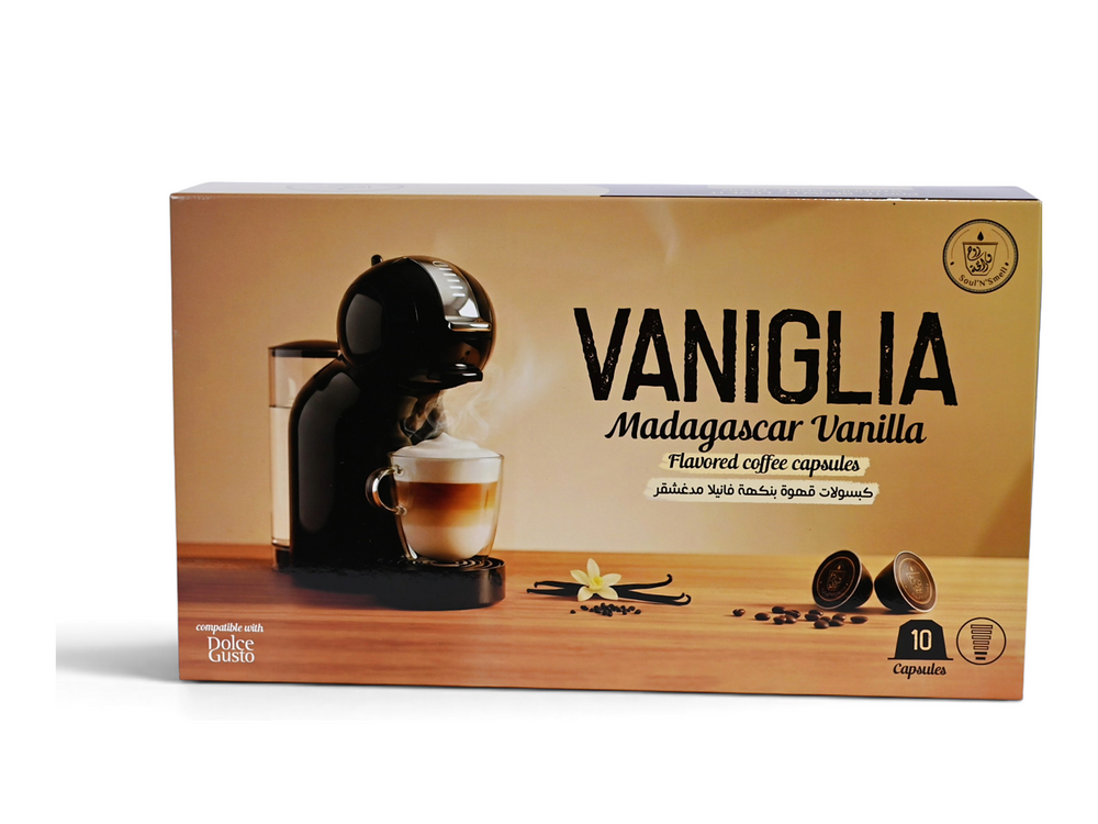 VANIGLIA - Vanilla Madagascar - A box of Vaniglia Madagascar Vanilla flavored coffee capsules, featuring a coffee machine and a cup of coffee on the front, with vanilla beans and capsules illustrated below.