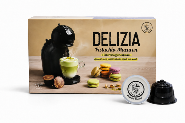 Delizizia Pistachio Macaron coffee capsule packaging with coffee machine and capsules on a wooden surface.
