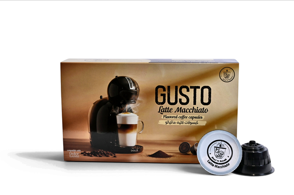 Gusto Latte Macchiato coffee capsule packaging with a coffee machine and cup on a white background
